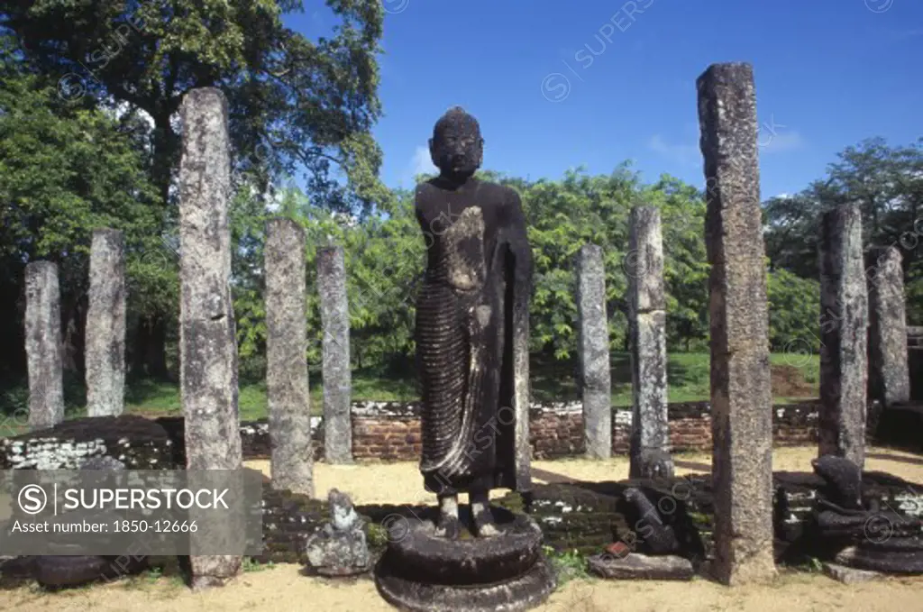 Sri Lanka, Polonnaruwa, The Atadage. Standing Buddha Statue Among Stone Columns Within The Quadrangle