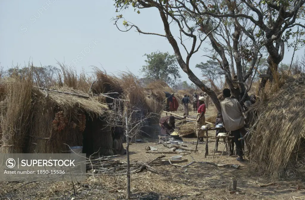 Burundi, Architecture, Hutu Village Dwellings With Women Cooking Over Open Fire.