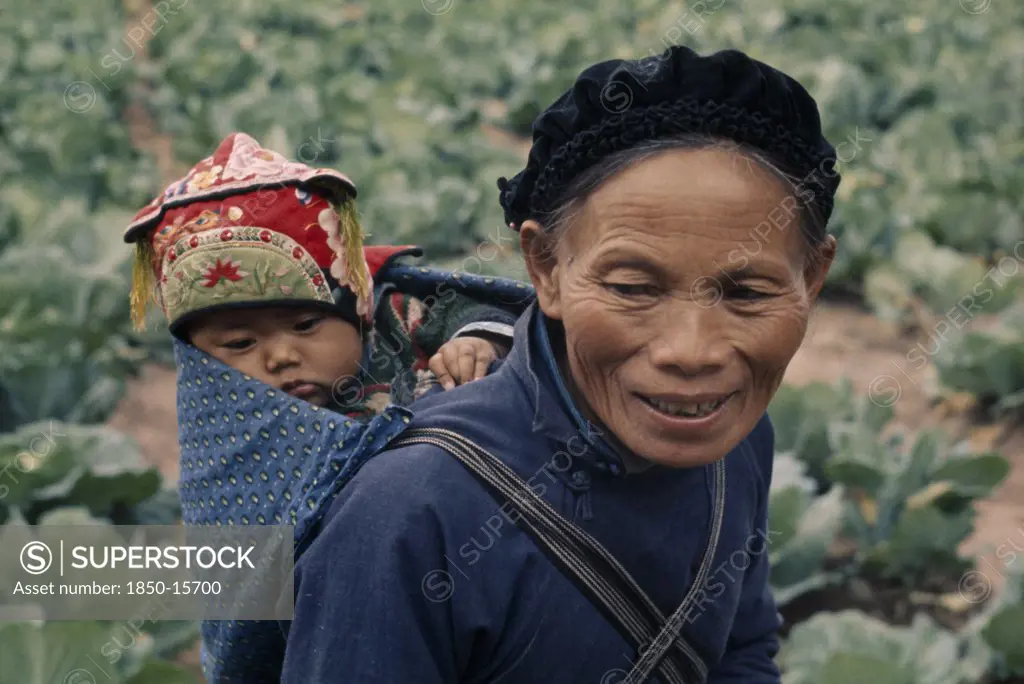 China, Children, Carrying, Woman From Miao Minority People Carrying Child On Her Back In Papoose.