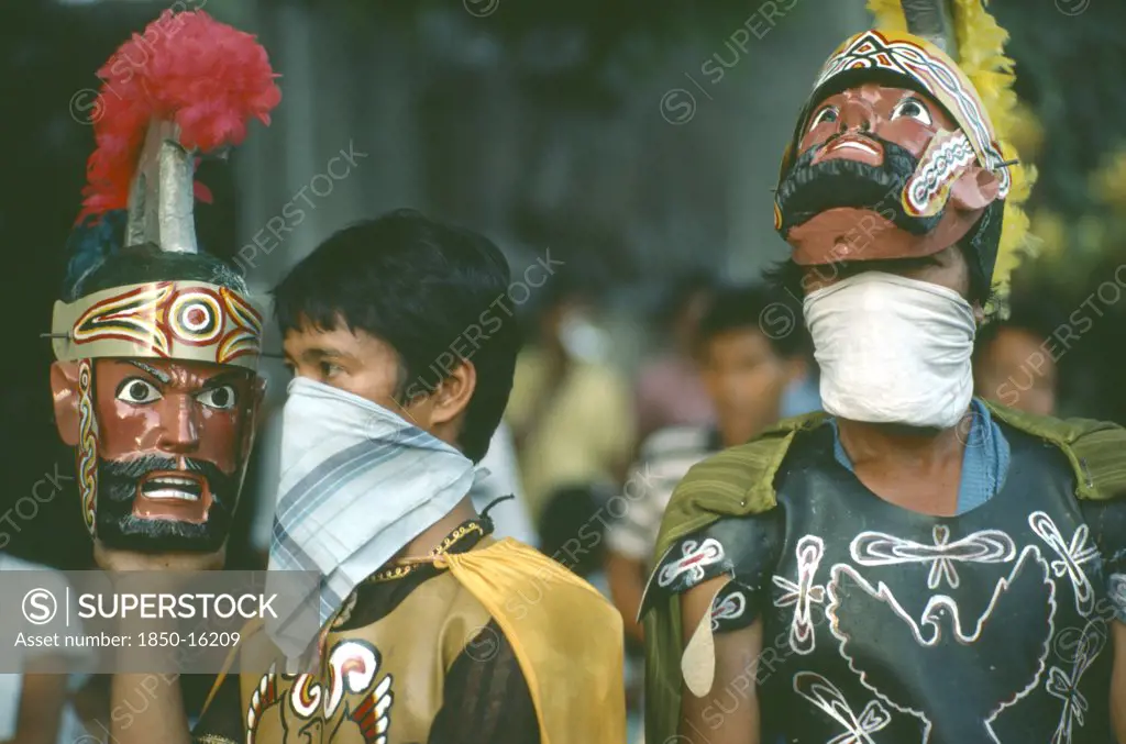 Philippines, People, 'Two Men In Costume, One Wearing And One Carrying Mask During The Ati-Atihan Festival.'