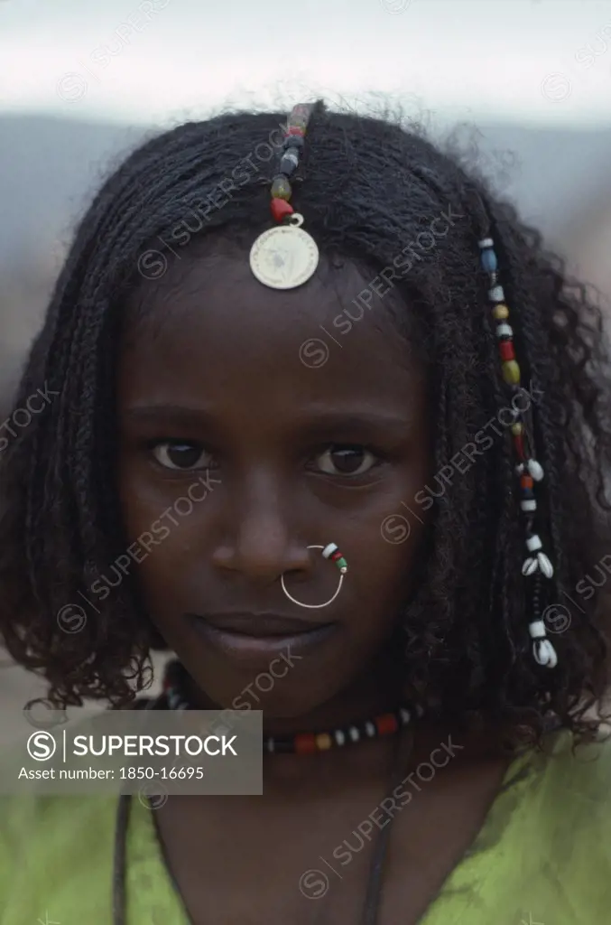 Sudan, North East, Gadem Gafriet Camp, Portrait Of Beni Amer Eritrean Refugee Girl Wearing Traditional Jewellery.