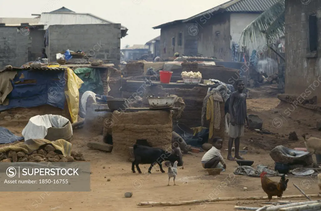 Ghana, Village Scene, 'Outside Ovens In Village Near Accra With Children, Goats And Chickens Around.'