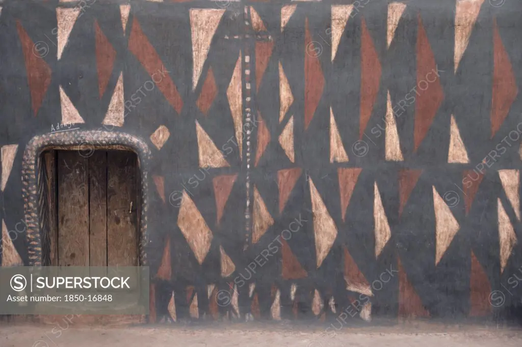 Ghana, North, Architecture, 'Traditional Mud Architecture.  Walls Painted With Broken Calabash Pattern In Red, Black And White, An Expression Of Ever Useful.  Raised Doorway Keeps Out Water.'