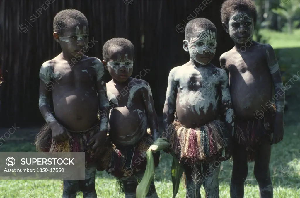 Papua New Guinea, Children, Sepik Children Wearing Body Paint And Grass Skirts.