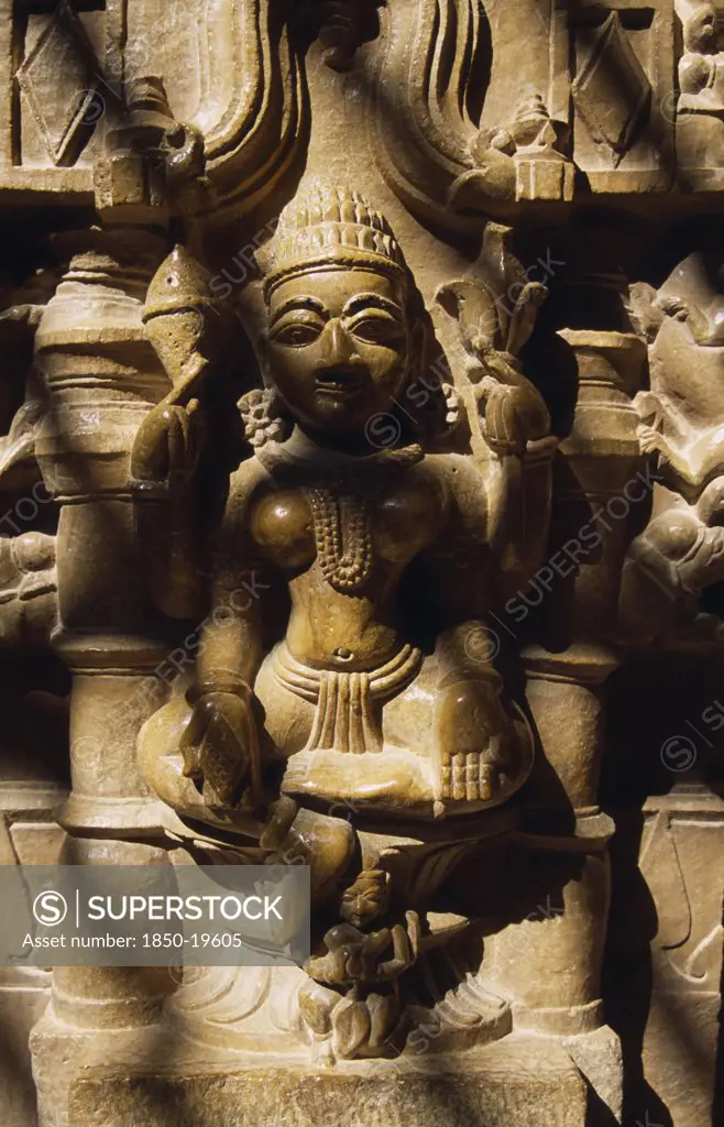 India, Rajasthan, Jaisalmer, Carved Hindu Iconography In Jain Temple In Old City.  Close View Disected By Lines Of Shadow.