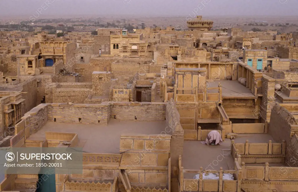 India, Rajasthan, Jaisalmer, View Over Flat Roof Houses Of Desert Town.