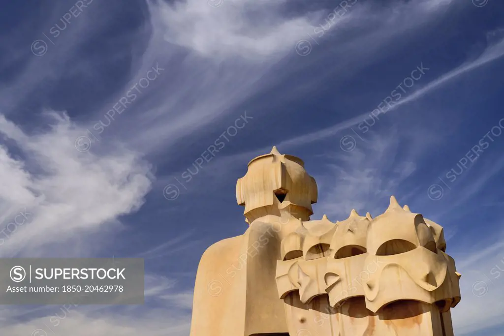 Spain, Catalunya, Barcelona, Antoni Gaudi's La Pedrera building, a section of chimney pots on the roof terrace.