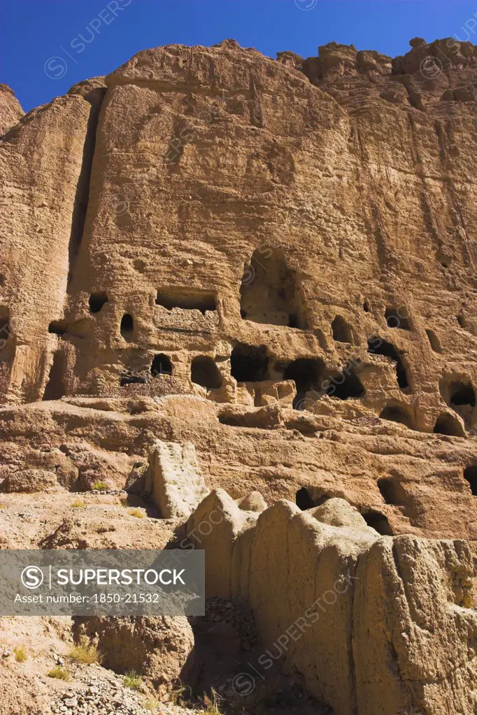 Afghanistan, Bamiyan Province, Bamiyan , Caves In Cliffs Near Empty Niche Where The Famous Carved Small Budda Once Stood 180 Foot High Before Being Destroyed By The Taliban In 2001