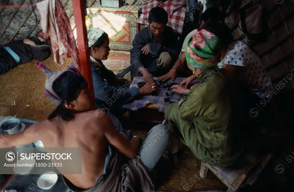 Mongolia, People, Playing Game Of Dominoes Inside Yurt.