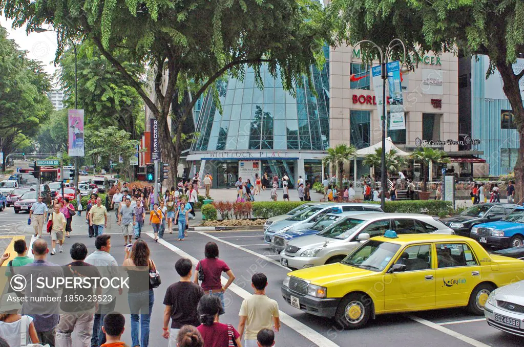 Singapore, Orchard Road, Pedestrian Crossing At Orchard Road And Patterson Road Showing Wheelock Place Shopping Centre Housing Among Others A Borders Book And Marks And Spencer Store.