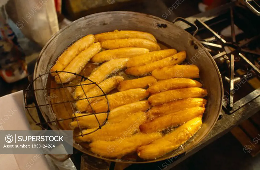 Mexico, Mexico City, Fried Bananas For Sale On Market Stall.