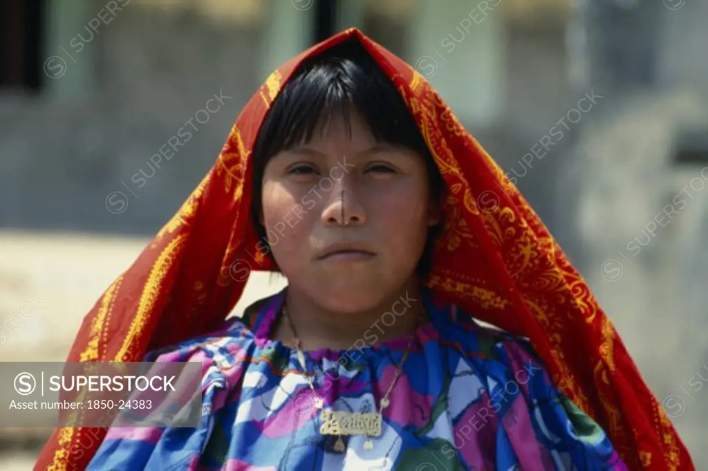 Panama, San Blas Islands, Kuna Indigenous Tribe, Portrait Of Young Kuna Indian Girl Wearing Traditional Gold Nose Ring With A Black Line Drawn Along Length Of Nose