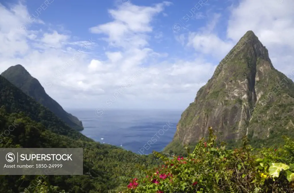 West Indies, St Lucia, Soufriere , Val Des Pitons The Volcanic Plugs Of Gros Piton On The Left And Petit Piton On The Right With The Lush Valley Seen From The Sun Deck Of The Ladera Spa Resort Hotel