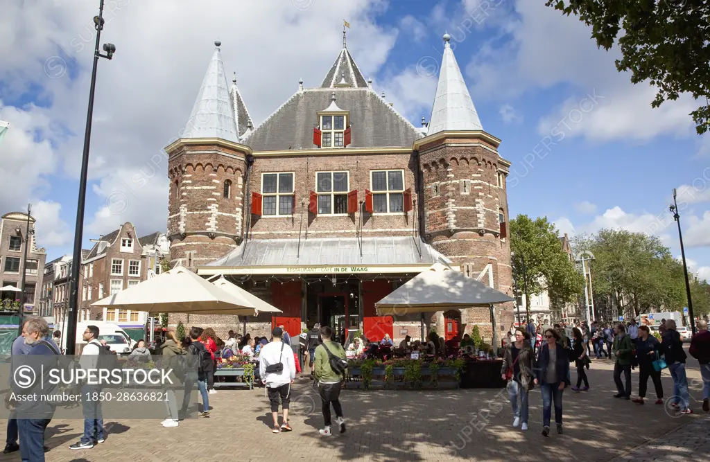 Holland, North, Amsterdam, Old city gate De Waag in the Nieuwmarkt neighbourhood, now a cafe.