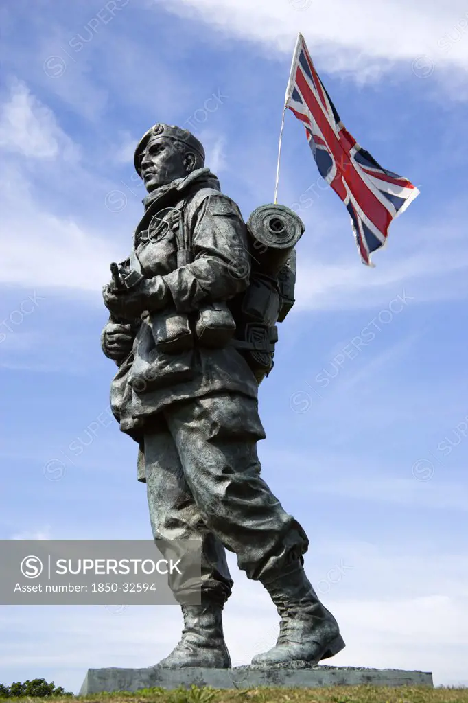 England, Hampshire, Portsmouth, Royal Marines Museum on Southsea Seafront with bronze sculpture titled Yomper by Philip Jackson modelled on a photograph of Corporal Peter Robinson yomping to Sapper Hill during the Falklands War.