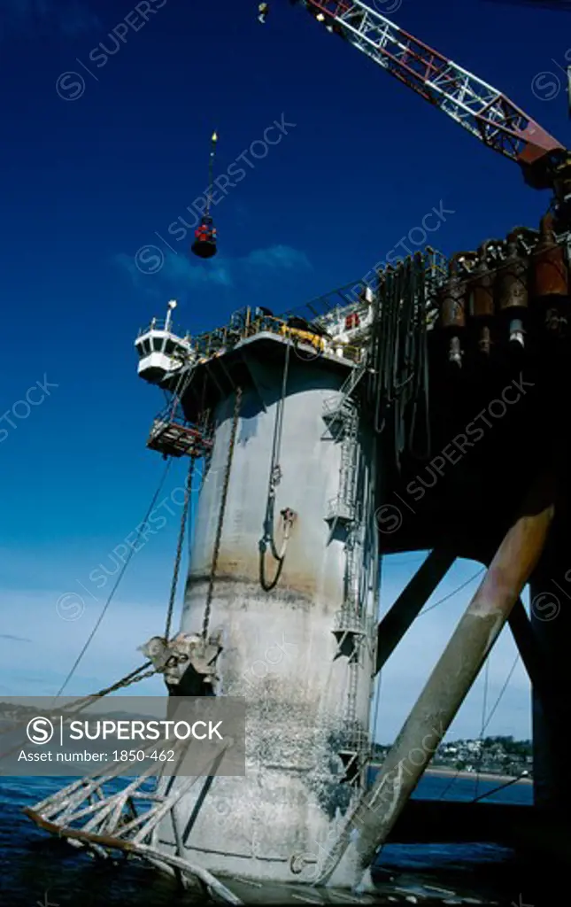 Industry, Factory, Oil Rig, Billy Pugh. Crew Embarking On To The Platform From A Crane