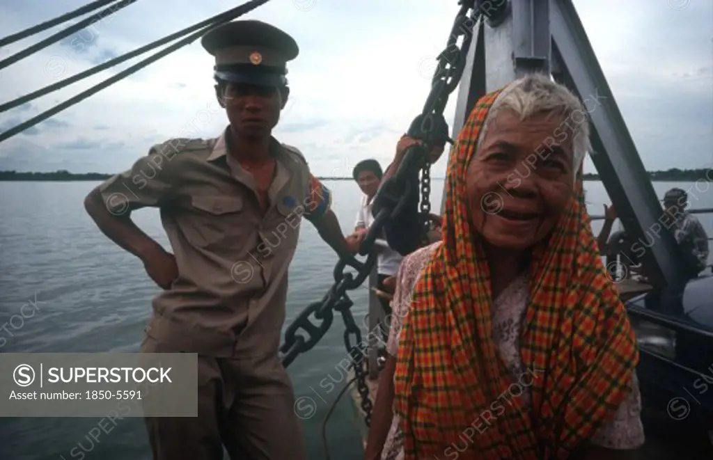 Cambodia, Neak Long, 'Passengers On The Mekong Ferry, Old Woman And Soldier. '