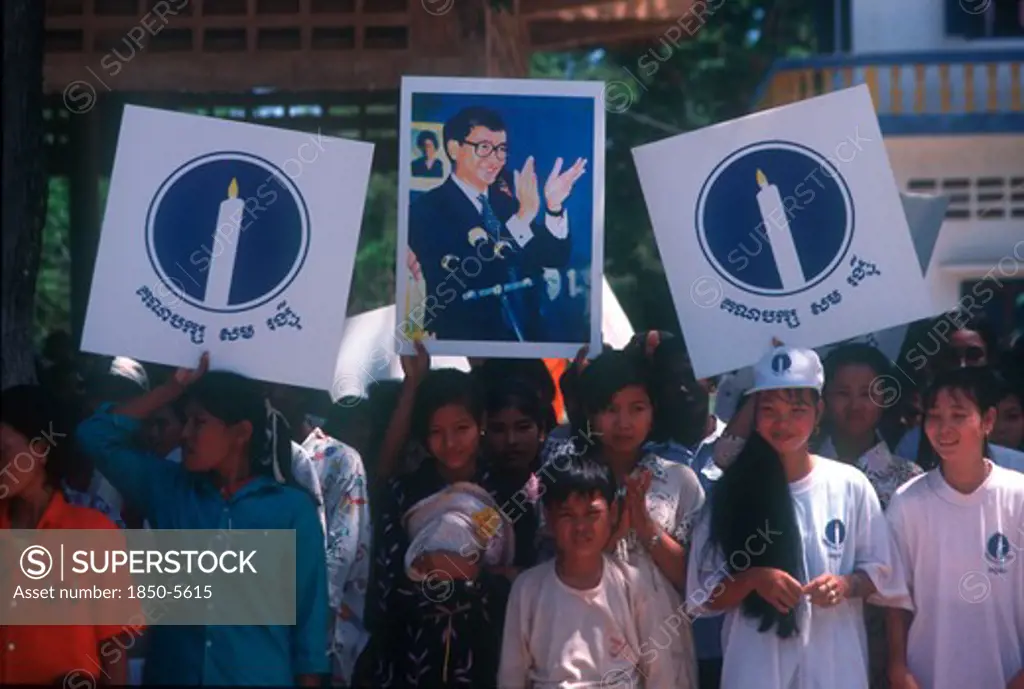 Cambodia, Politics, Crowd Waving Election Campaign Posters.