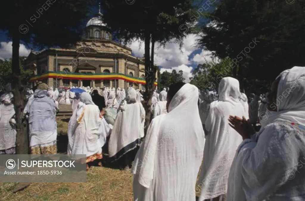 Ethiopia, Addis Ababa, 'St George Church, Kidus Giorgis, The Principle Church In Addis Ababa Draped In The Colours Of The National Flag.  Large Group Of People Gathered To Attend Ceremony.'