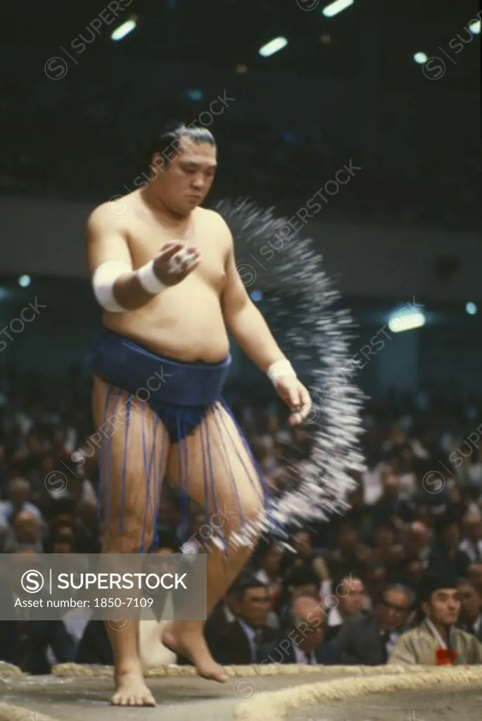 Japan, Honshu, Tokyo, Sumo Wrestler Throwing Salt