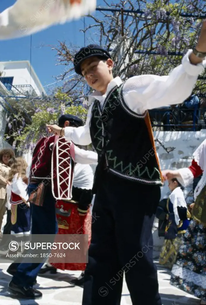 Greece, Cyclades Islands, Amorgos, Langada. Boy In Costume Performing Traditional Greek Dancing