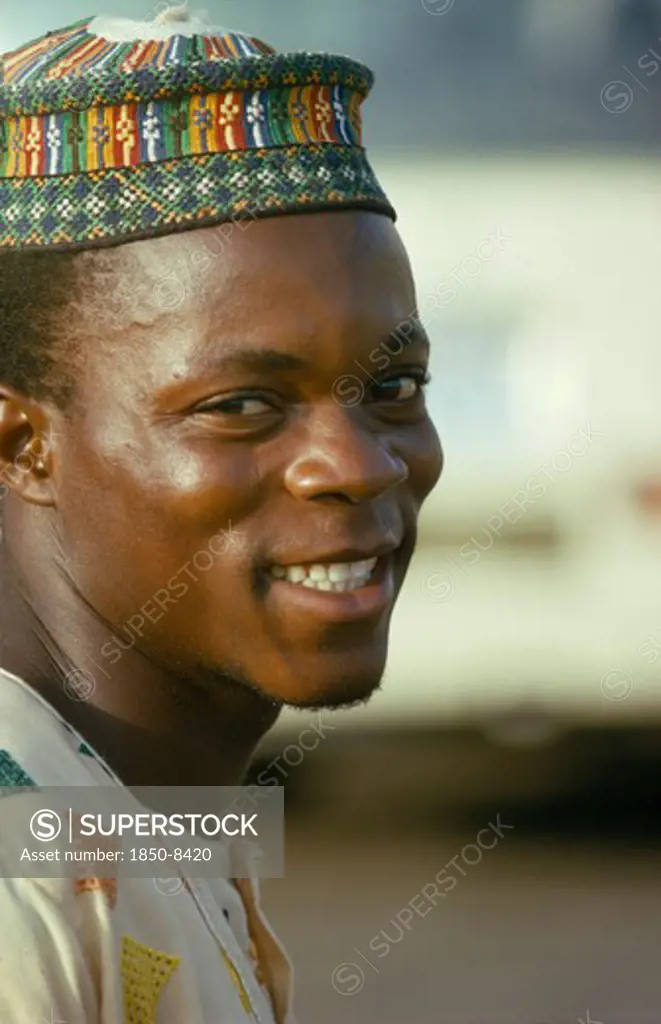 Nigeria, People, Portrait Of Smiling Young Ibo Man.