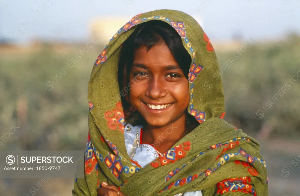 Pakistan, Sindh Province, Portrait Of Smiling Gypsy Girl.