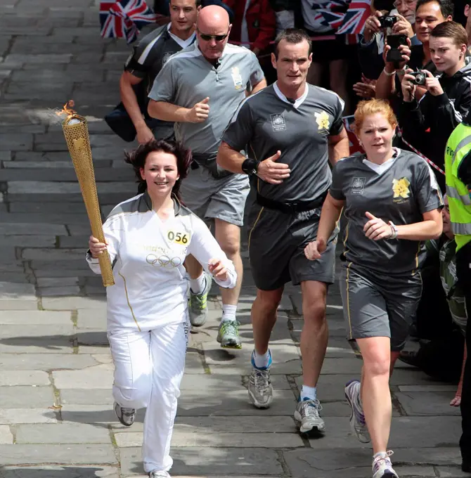 England, Kent, Tunbridge Wells, Olympic Torch relay running through the Pantiles.