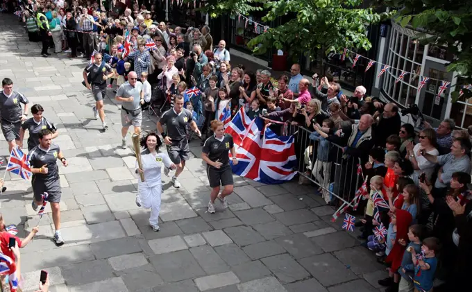 England, Kent, Tunbridge Wells, Olympic Torch relay running through the Pantiles.