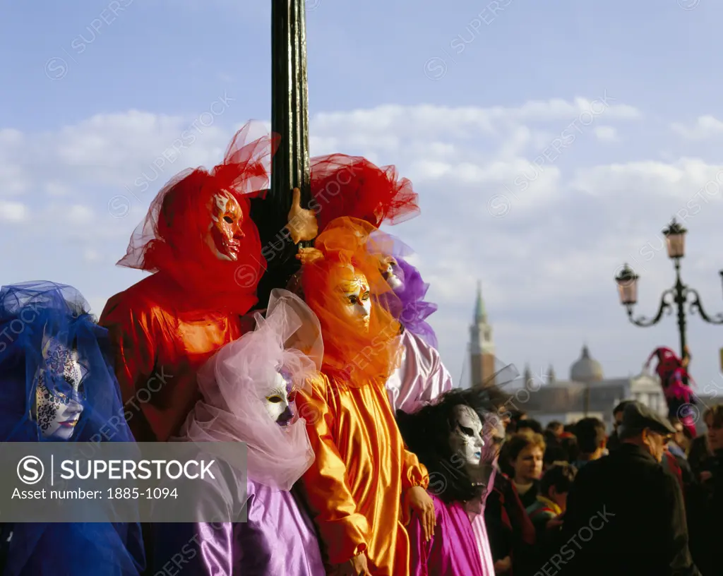 Italy, Veneto, Venice, Venice Carnival - colourful masked figures