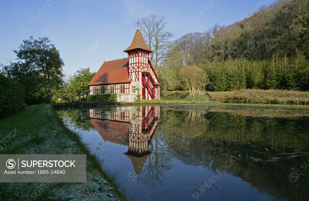 UK - England, Somerset, Rickford, Colouful church beside river in winter