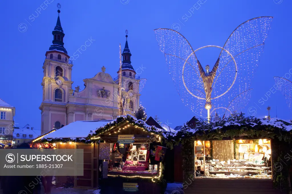 Germany, Baden Wurttemberg, Ludwigsburg, Christmas Market and church at dusk