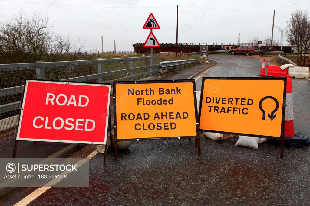 Image of road signs flooded river Nene B1040 road Whittlesey