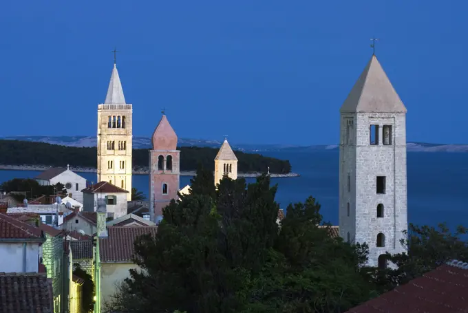 Croatia, Kvarner Gulf, Rab Island, Rab Town - view over campaniles of the old town at dusk