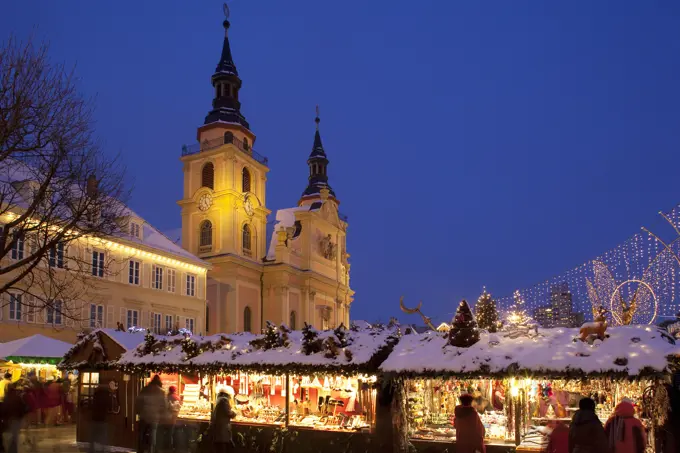 Germany, Baden Wurttemberg, Ludwigsburg, Christmas Market and church at dusk