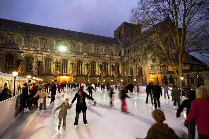 UK - England, Hampshire, Winchester, Christmas Ice Skating Rink outside Winchester Cathedral