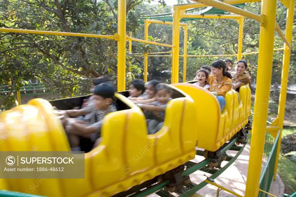 People enjoying roller coaster ride in Amusement park Tikuji ni