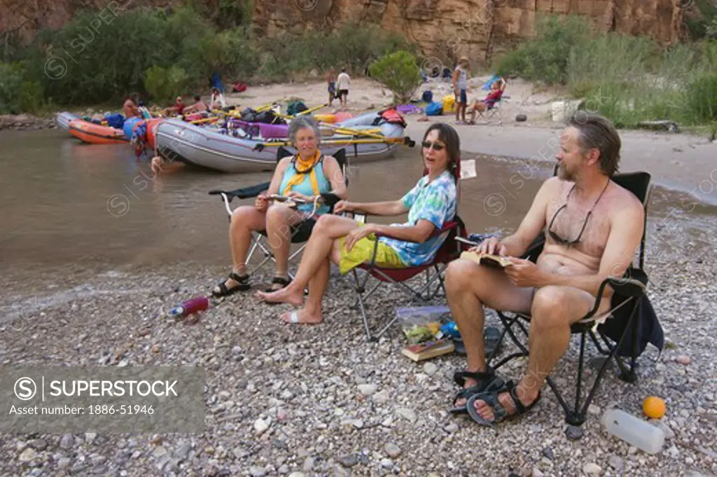 Rafters relax at PARASHANT CANYON CAMP AT Colorado River MILE 198 - GRAND CANYON NATIONAL PARK, ARIZONA