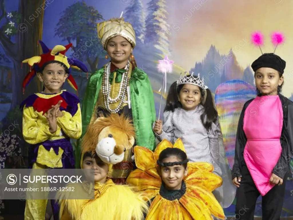 South Asian Indian boys and girls performing fancy dress competition on stage in nursery school MR SuperStock