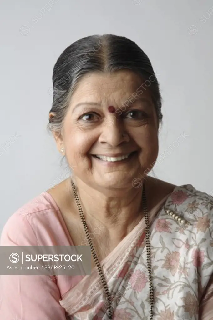 Old lady wearing saree, Mangalsutra, dimond nose stud or ring, Kumkum, ornaments of a married woman and living husband, Saree pin, with smiling face, MR # 703A