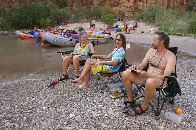 Rafters relax at PARASHANT CANYON CAMP AT Colorado River MILE 198 - GRAND CANYON NATIONAL PARK, ARIZONA