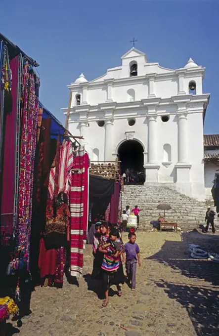 STREET MARKET selling traditional TEXTILES in front of SANTO TOMAS CHURCH - CHICHICASTENANGO, GUATEMALA