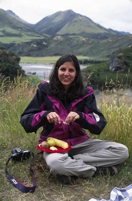 Travelers eat lunch overlooking the WAIAU RIVER VALLEY near HY 7 - SOUTH ISLAND, NEW ZEALAND