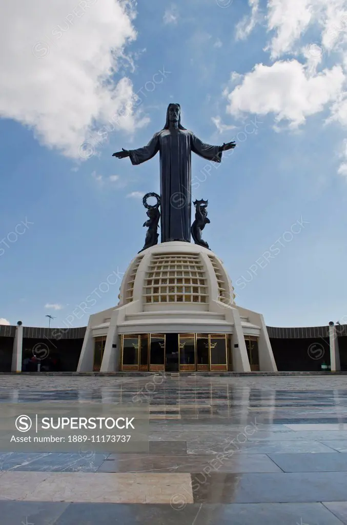 Tall Jesus Christ statue surrounded by marble floor; Silao, Guanajuato, Mexico