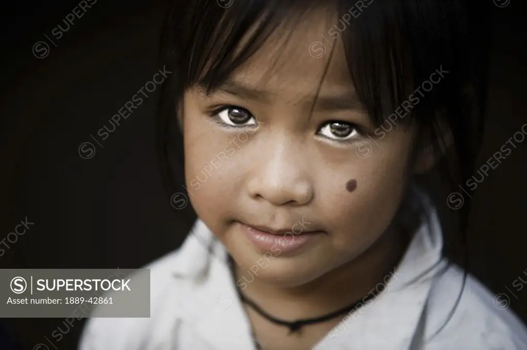 Luang Prabang, Laos; Portrait of boy smiling at camera