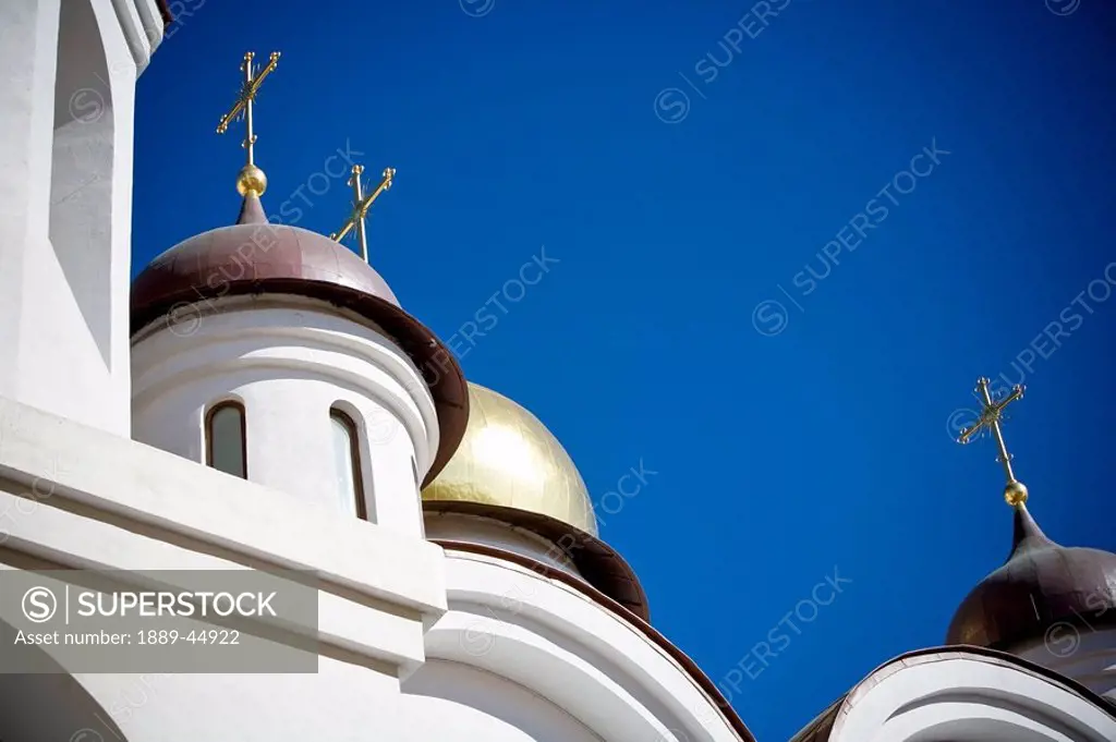 A low angle shot of a white church