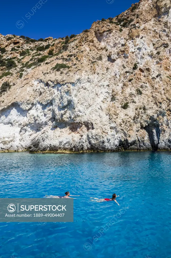 Tourists swimming, Galazia Nera Bay; Polyaigos Island, Cyclades, Greece