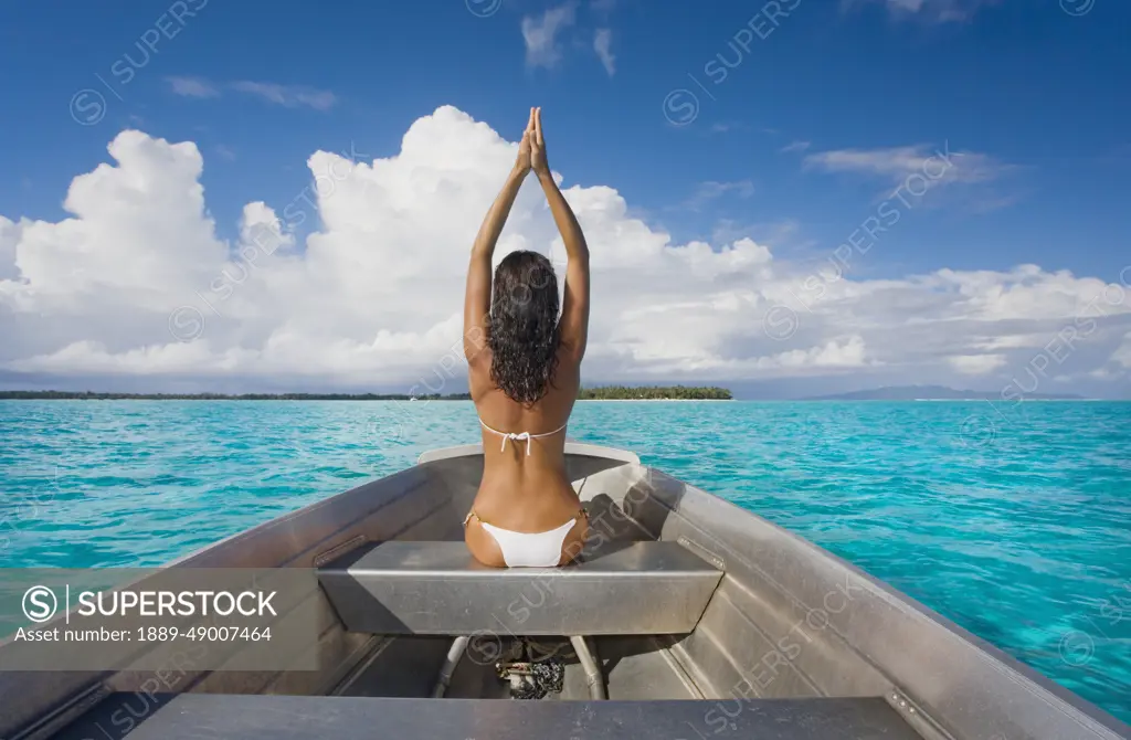 French Polynesia, Tahiti, Bora Bora, Woman Sitting In Boat.