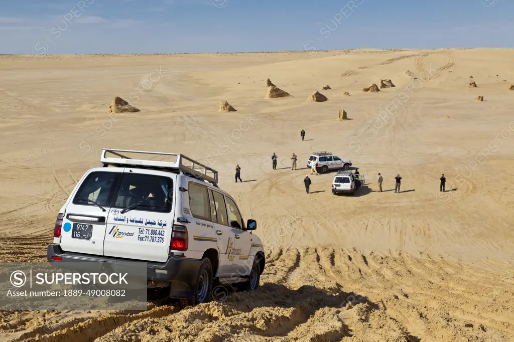 Tourists Exploring The Desert In 4X4 Vehicles; Tunisia, North Africa