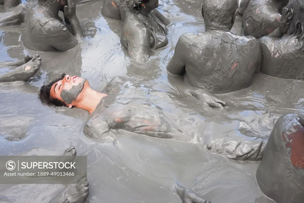 Tourists Getting Skin Enhancing Treatment At El Totumo Mud Volcano, Catagena, Colombia